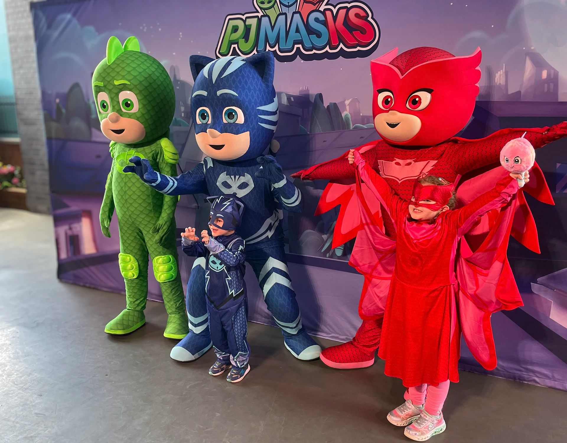 Cody and JJ from CoComelon pose with fans at a live meet and greet