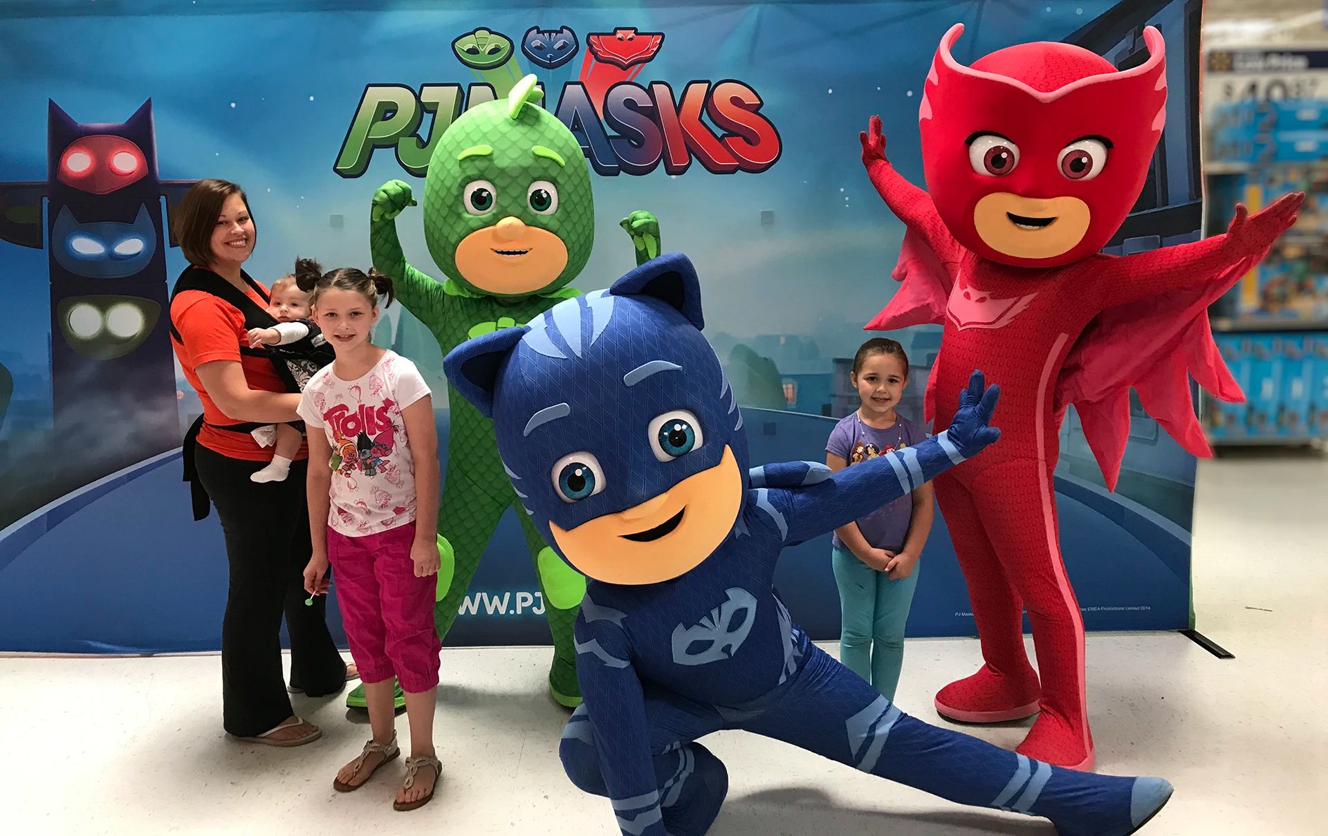 JJ from CoComelon high fiving a little fan